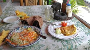 Breakfast in one the the cheaper places at JL Arjuna - plenty of salad and omelet with coconut oil and papaya drink, Ubud, Bali