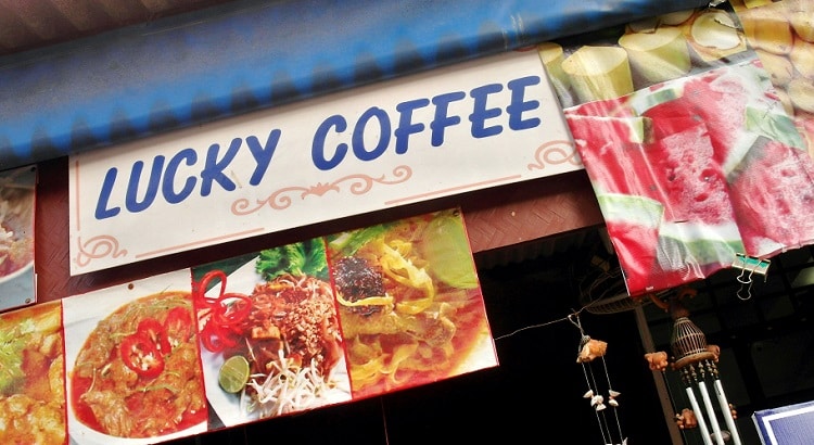 Where to eat and sleep in Chiang Mai, Thailand. Lucky Coffee street restaurant sign.